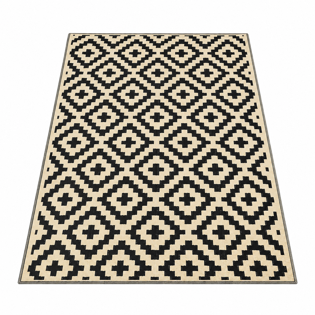 Black and beige plastic straw outdoor rug with geometric tribal pattern