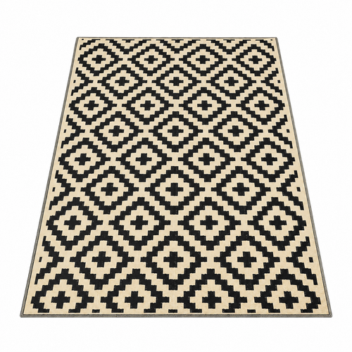 Black and beige plastic straw outdoor rug with geometric tribal pattern