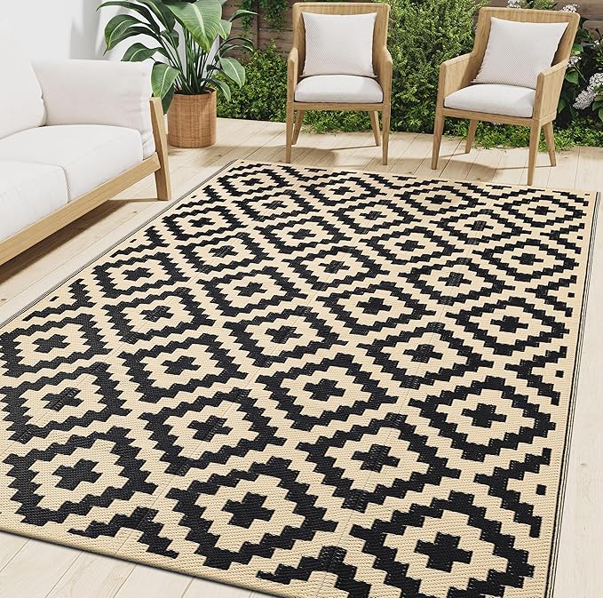 Waterproof plastic straw outdoor rug at an RV campsite, lightweight and foldable